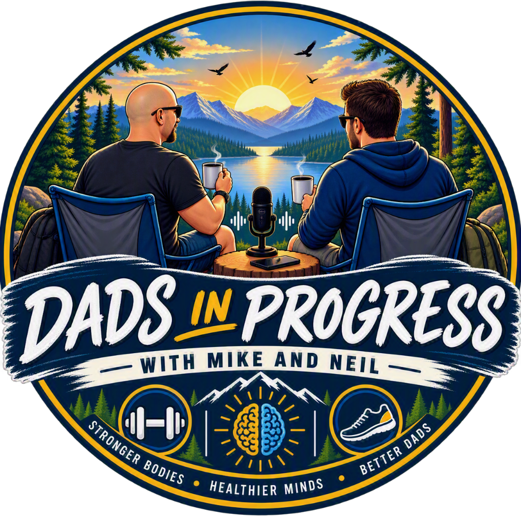Dads In Progress with Mike and Neil — two dads in camp chairs by a mountain lake at sunrise, a microphone between them